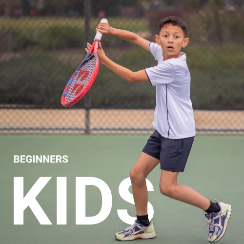 latino kid boy hitting forehand tennis on a court