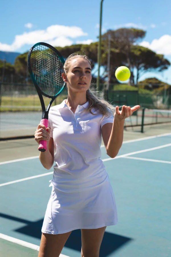 Caucasian woman playing tennis